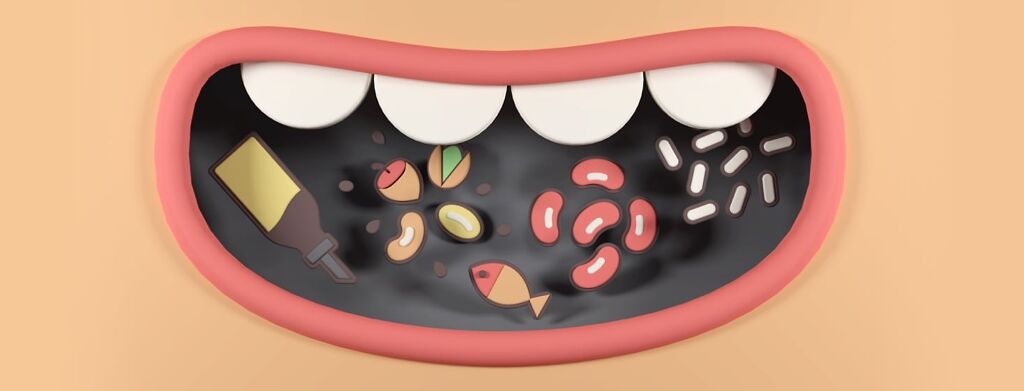 An open mouth with a variety of anti-inflammatory foods inside of it