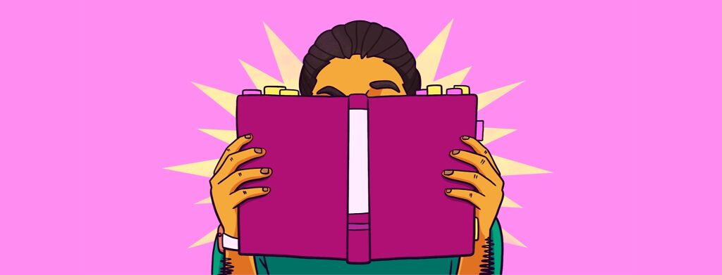 A person has their head buried in a book.